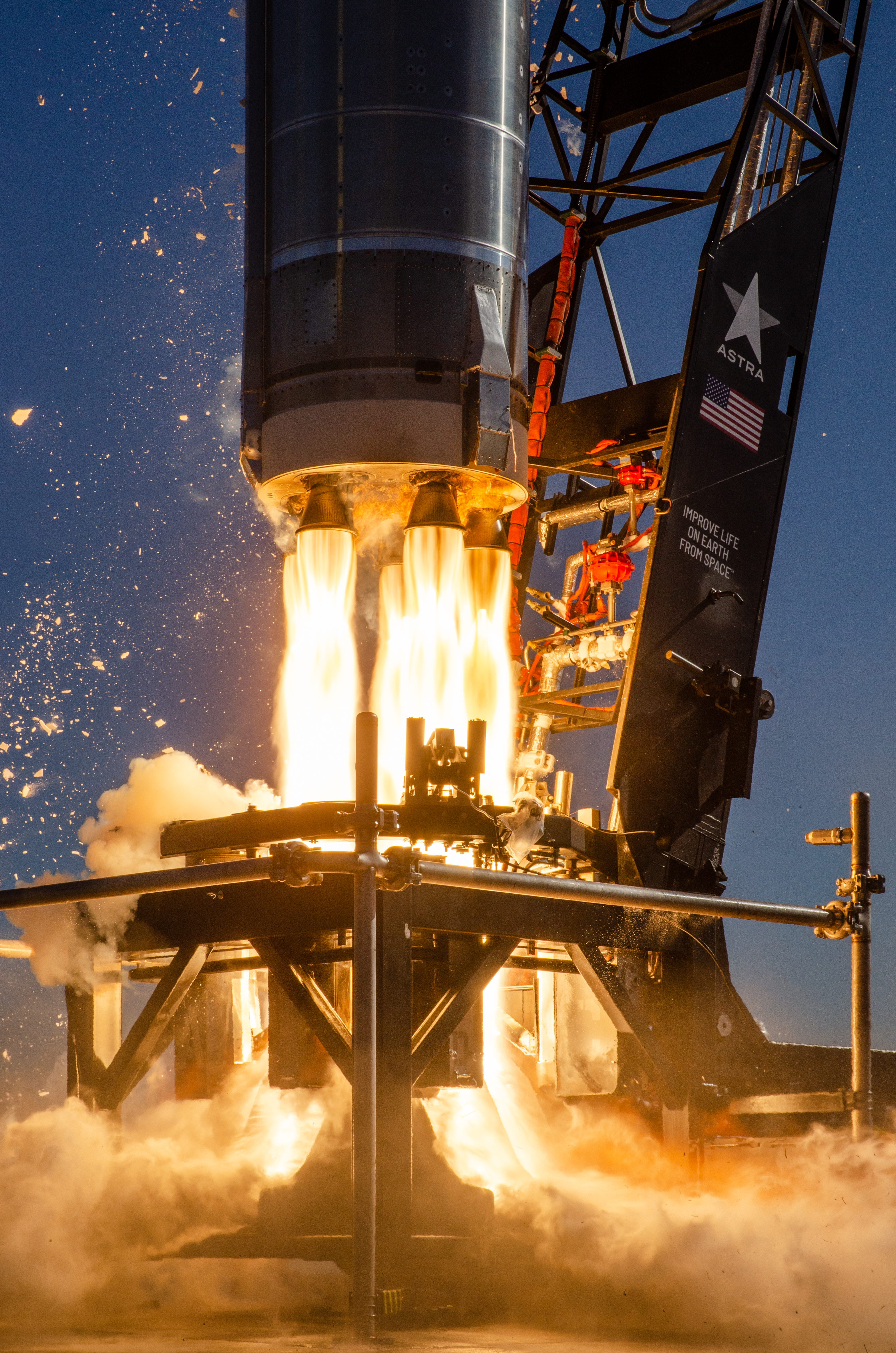 Astra rocket lifting off from Cape Canaveral, Astra logo visible on the strongback